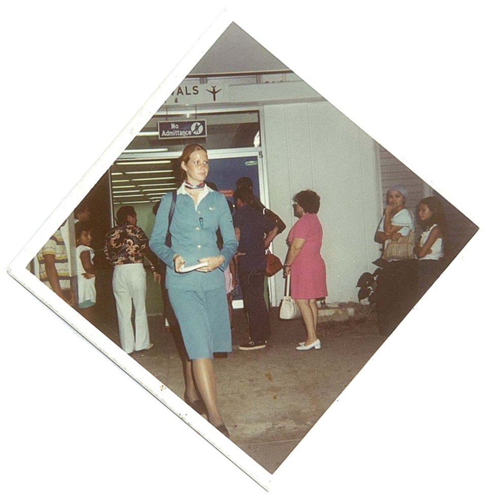 1970s Pan Am flight attendant exiting the Guam Immigration Hall and heading towards the crew van.